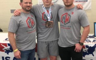 Midwest Wrestling Regional Training Center Coaches Chris Fleeger and Josh Harper with club wrestlers at Indiana Freestyle States